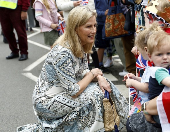 Britain&#039;s Sophie, the Duchess of Edinburgh greets people as she arrives to attend a Big Lunch with residents and representatives from the Royal British Legion, the Scouts and the Guides, in Cranl ...