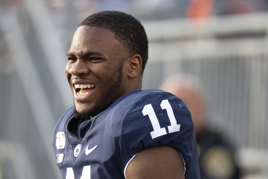 FILE - In this Aug. 31, 2019, file photo, Penn State linebacker Micah Parsons (11) laughs on the bench in the fourth quarter of an NCAA college football game against Idaho in State College, Pa. Parson ...