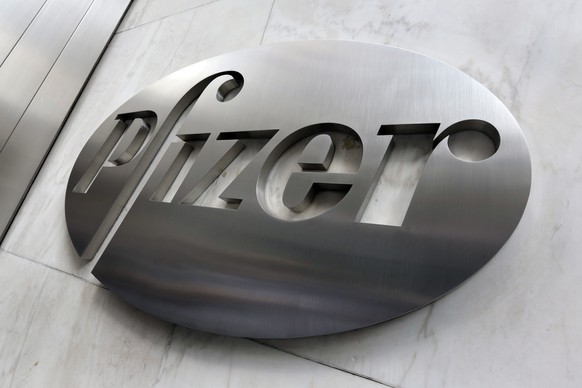 FILE - This Dec. 4, 2017, photo shows the Pfizer company logo at the company's headquarters in New York. Higher medicine sales helped the drug giant swing to a small profit in the fourth-quarter, despite big increases in spending on research and production, but it still missed Wall Street expectations. (AP Photo/Richard Drew, File)
Pfizer