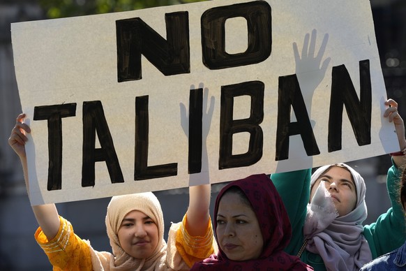 People protest in Parliament Square at the anniversary of the Taliban takeover of Afghanistan in London, Tuesday, Aug. 15, 2023. The Afghanistan and Central Asian Association has organised a peaceful  ...