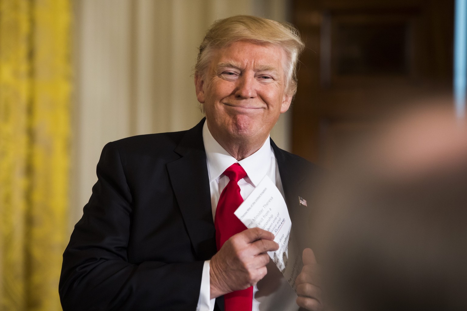 epa05755139 US President Donald J. Trump prepares to speak at a joint press conference with British Prime Minister Theresa May in the East Room of the White House in Washington, DC, USA, 27 January 20 ...