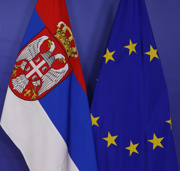 epa04033890 The Serbian Flag next to the European Union flag at the European Commission as Serbian Prime Minister Ivica Dacic have a meeting with EU Commission President Jose Manuel Barroso (both not  ...