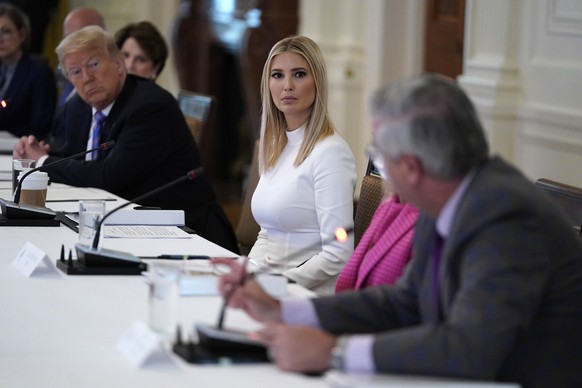 President Donald Trump and Ivanka Trump listen during a meeting with the American Workforce Policy Advisory Board, in the East Room of the White House, Friday, June 26, 2020, in Washington. (AP Photo/ ...