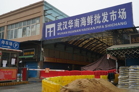 The Wuhan Huanan Wholesale Seafood Market, where a number of people related to the market fell ill with a virus, sits closed in Wuhan, China, Tuesday, Jan. 21, 2020. Heightened precautions were being  ...