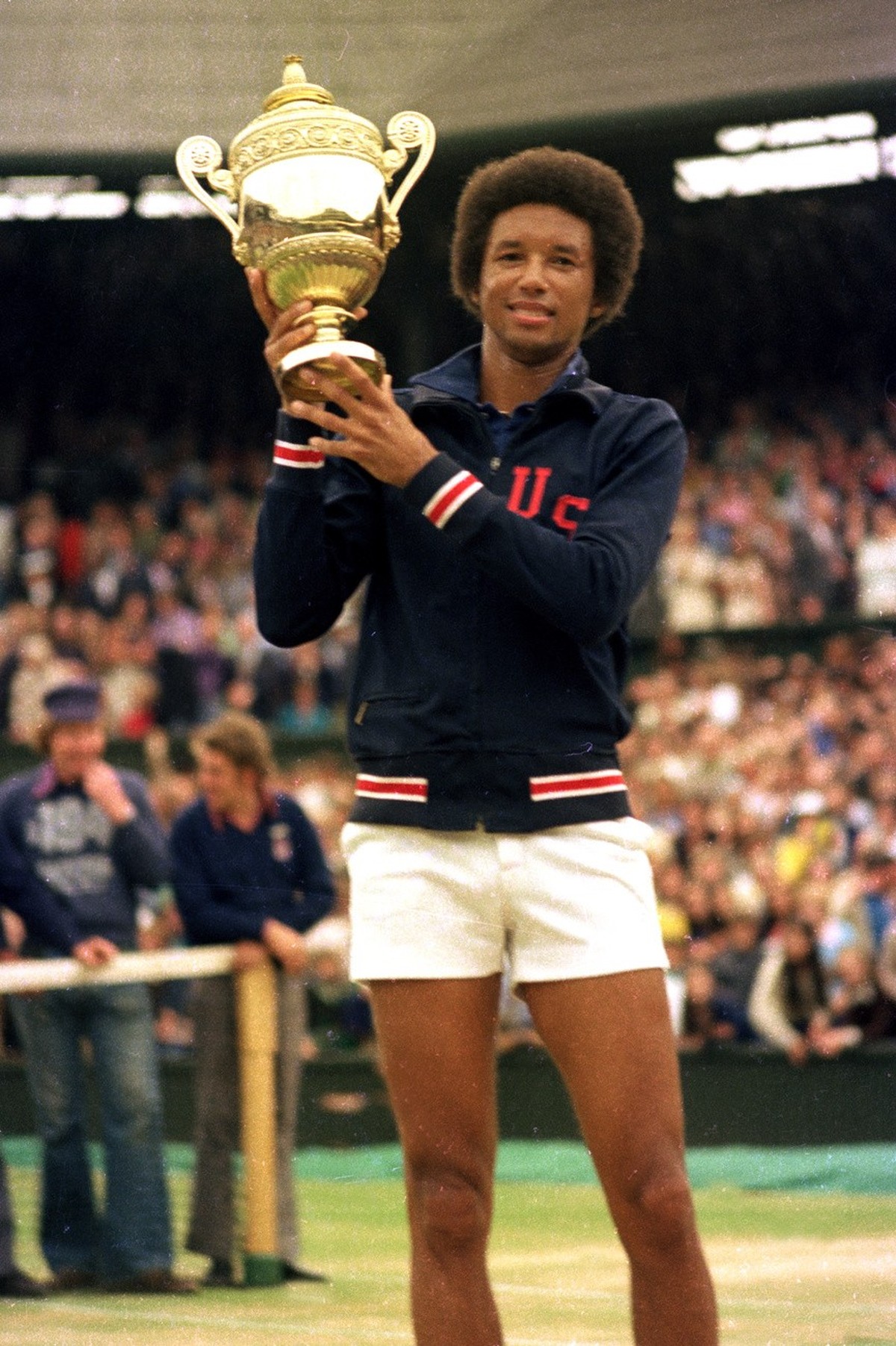 FILE - In this July 5, 1975 file photo, Arthur Ashe holds his Wimbledon trophy cup after defeating fellow American Jimmy Connors in the final match of the men's singles championship at the All En ...
