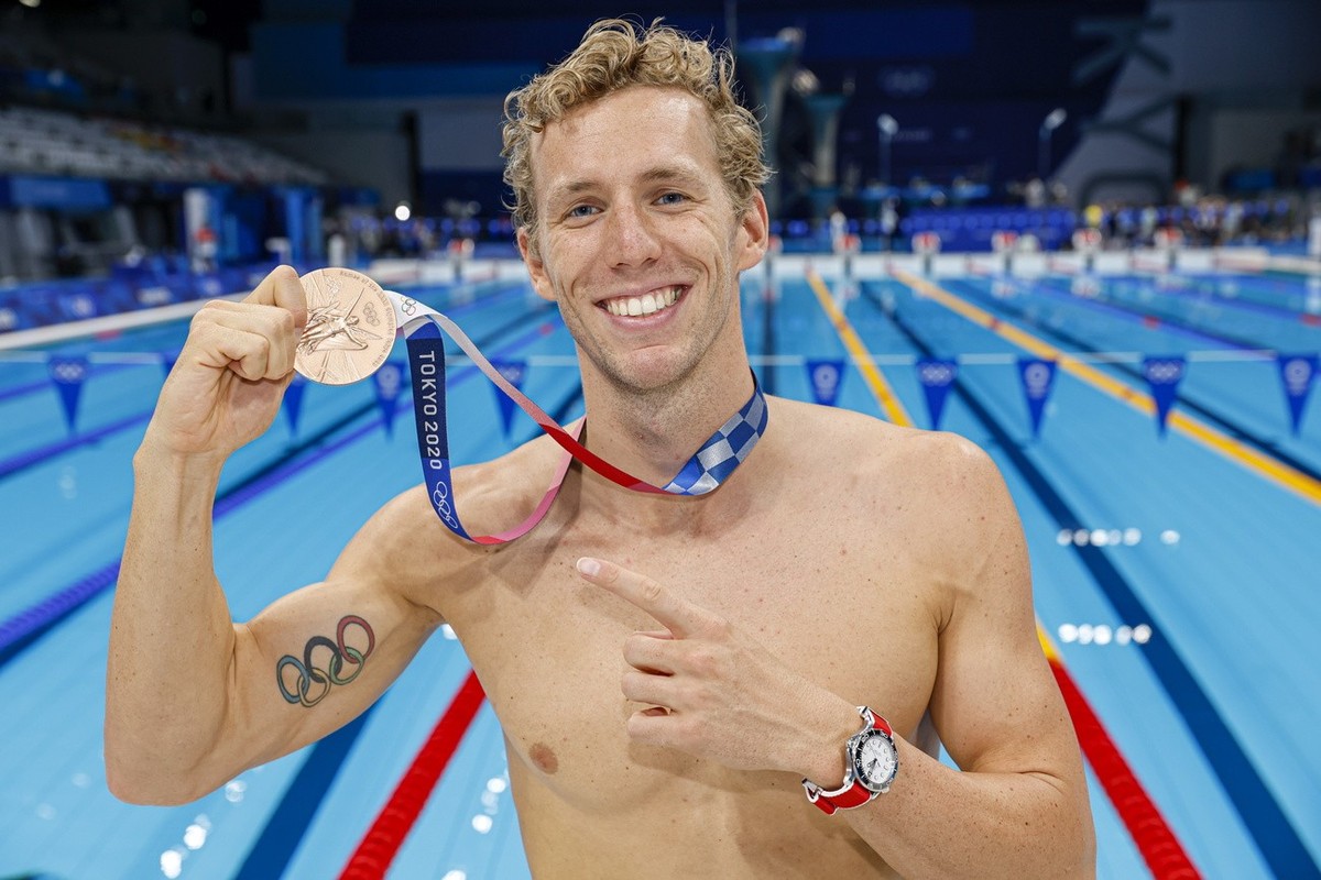 epa09378515 Jeremy Desplanches of Switzerland poses with his Bronze medal after finishing third in the men's 200m Individual Medley Final during the Swimming events of the Tokyo 2020 Olympic Game ...