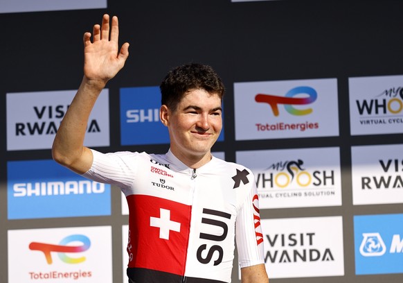 epa12407940 Second placed Jan Huber of Switzerland waves on the podium during the medal ceremony for the Men Under 23 race at the UCI Road Cycling World Championships in Kigali, Rwanda, 26 September 2 ...