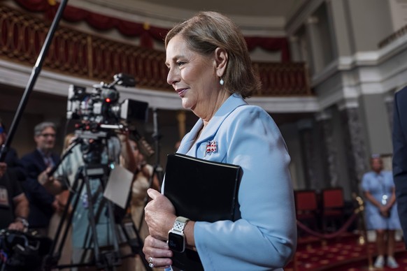 Newly-sworn Sen. Darline Graham, R-S.C., sister of Lindsey Graham, walks past cameras as she leaves the Old Senate Chamber following a cermonial oath of office ceremony allowing her to serve as her la ...