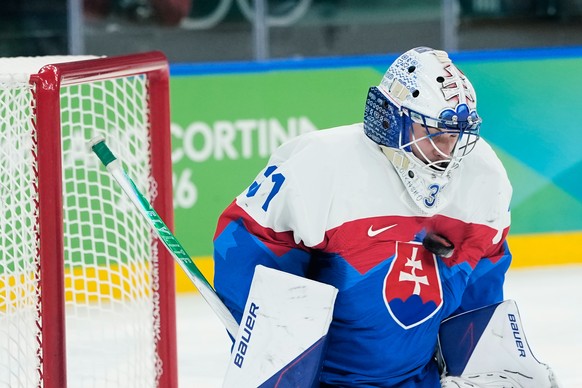 Slovakia's goalkeeper Samuel Hlavaj (31) blocks a shot during a men's ice hockey bronze medal game between Slovakia and Finland at the 2026 Winter Olympics, in Milan, Italy, Saturday, Feb. 2 ...