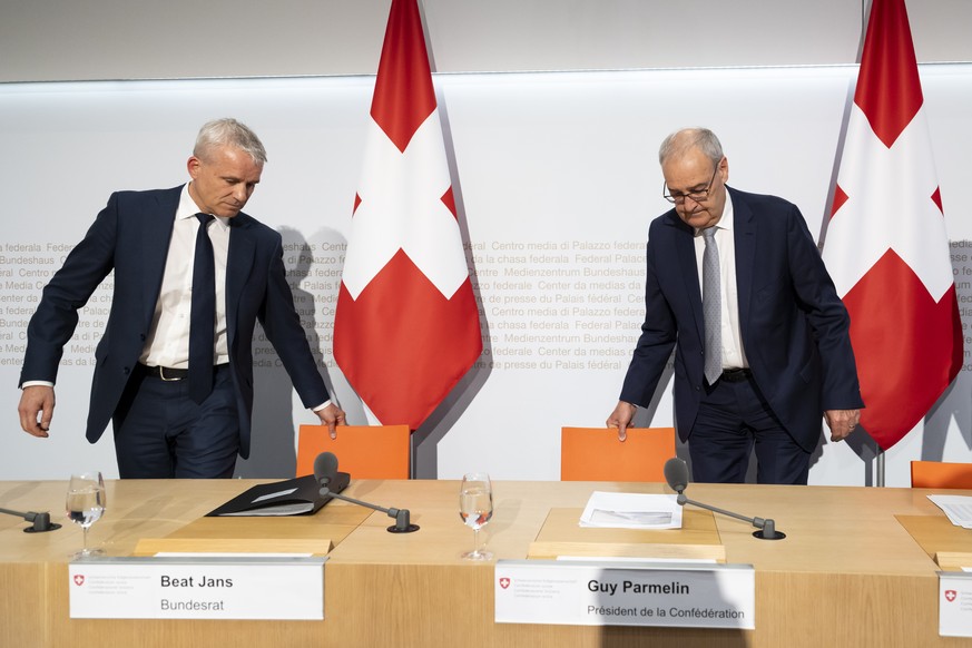 epa13036568 Federal Councilor Beat Jans (L) and Swiss Federal President Guy Parmelin (R) take their seats shortly before a press conference on the referendum results during the Swiss referendums in Be ...
