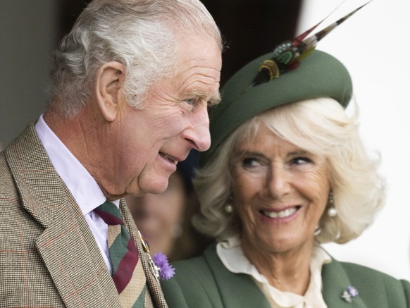 This photo provided by Buckingham Palace on Sunday, Dec. 11, 2022 has been chosen for King Charles III and the Queen Consort&#039;s 2022 Christmas card. The photograph was taken at the Braemar Games o ...