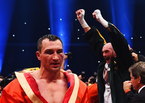 DUESSELDORF, GERMANY - NOVEMBER 28: Tyson Fury celebrates as he defeats Wladimir Klitschko to become new World Heavyweight Champion during the IBF IBO WBA WBO Heavyweight World Championship contest at ...