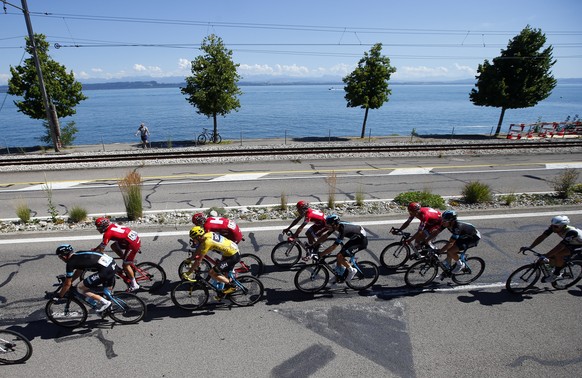 The pack with Britain's Chris Froome, wearing the overall leader's yellow jersey rides during the sixteenth stage of the Tour de France cycling race over 209 kilometers (129.9 miles) with st ...
