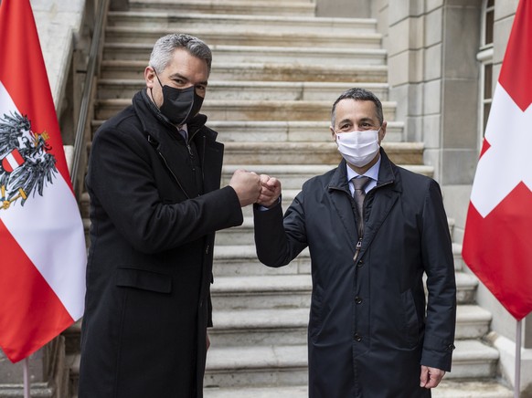 Swiss Federal President Ignazio Cassis, right, welcomes Karl Nehammer, Chancellor of Austria, to an official visit, in Zofingen, Switzerland, Monday, Feb. 14, 2022. (Alessandro della Valle/Keystone vi ...