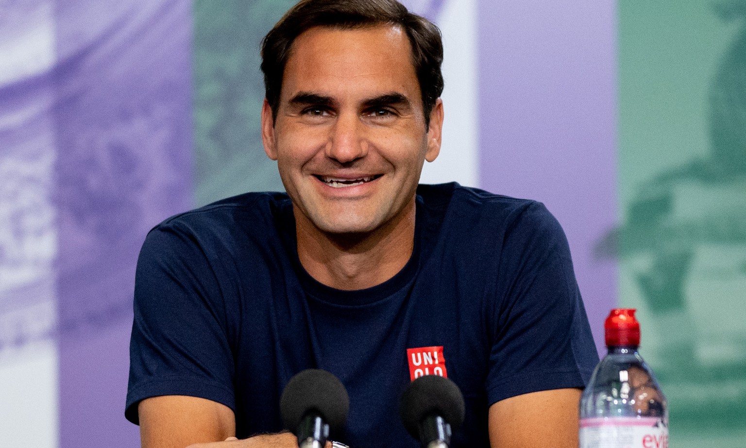 epa09302586 Swiss player Roger Federer attends a press conference in the main interview room ahead of the Wimbledon Championships held at The All England Lawn Tennis Club, Wimbledon, Britain, 26 June  ...