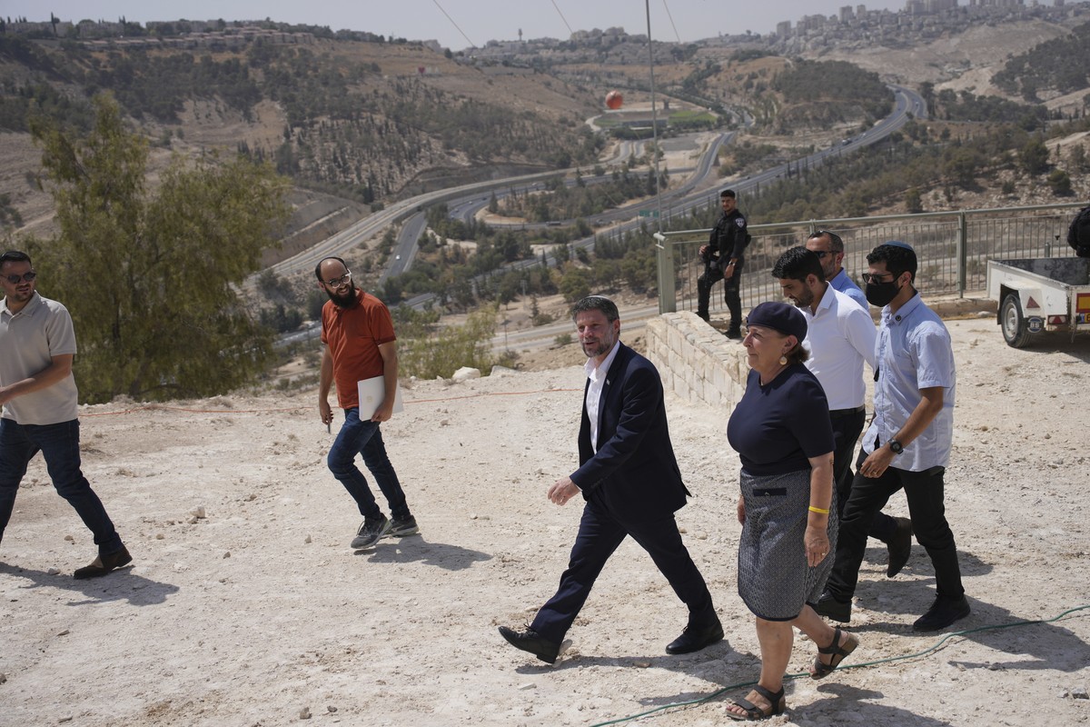 CORRECTS DAY Israeli Finance Minister Bezalel Smotrich arrives for a press conference about new settlement construction in the Israel-occupied West Bank near Maale Adumim, Thursday, Aug. 14, 2025. (AP ...