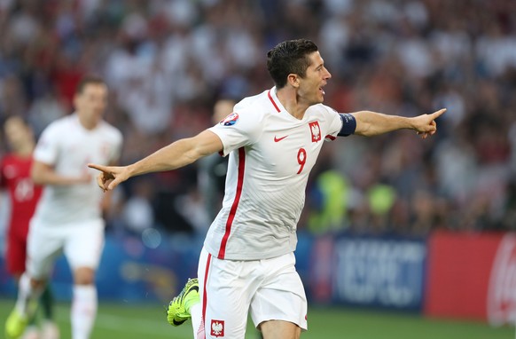 Poland&#039;s Robert Lewandowski celebrates after scoring the opening goal during the Euro 2016 quarterfinal soccer match between Poland and Portugal, at the Velodrome stadium in Marseille, France, Th ...