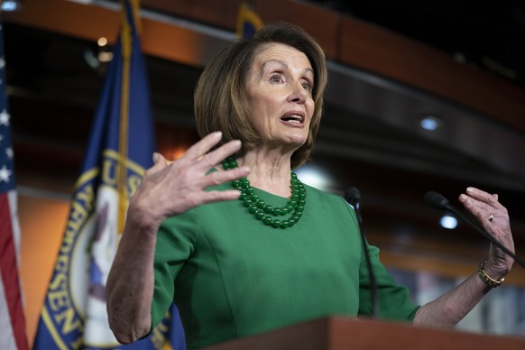 House Democratic Leader Nancy Pelosi of California, talks to reporters as Congress tries to pass legislation that would avert a partial government shutdown, at the Capitol in Washington, Thursday, Dec ...