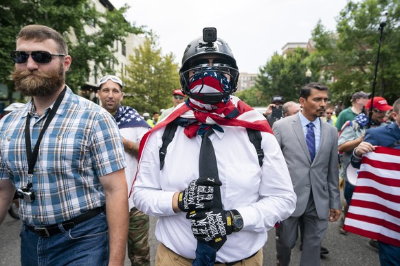epa06946800 White supremacists and members of the alt-right march to the White House on the anniversary of last year&#039;s &#039;Unite the Right&#039; rally in Washington, DC, USA, 12 August 2018. On ...