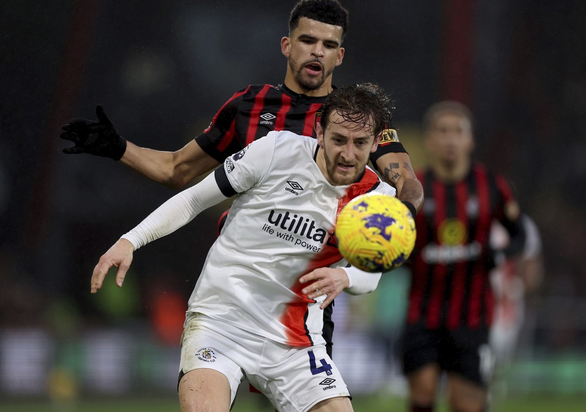 Luton Town's Tom Lockyer, front, and Bournemouth's Dominic Solanke battle for the ball during the English Premier League soccer match between Bournemouth and Luton Town at the Vitality Stadi ...