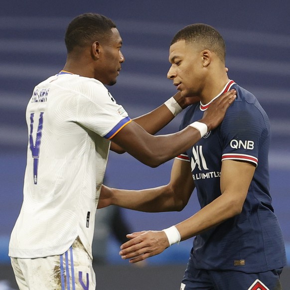 epa09813714 Real Madrid&#039;s David Alaba (L) and Paris Saint-Germain&#039;s Kylian Mbappe (R) react after the UEFA Champions League round of 16, second leg soccer match between Real Madrid and Paris ...