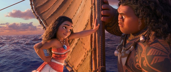 This image released by Disney shows characters Maui, voiced by Dwayne Johnson, right, and Moana, voiced by Auli&#039;i Cravalho, in a scene from the animated film, &quot;Moana.&quot; The film was nomi ...