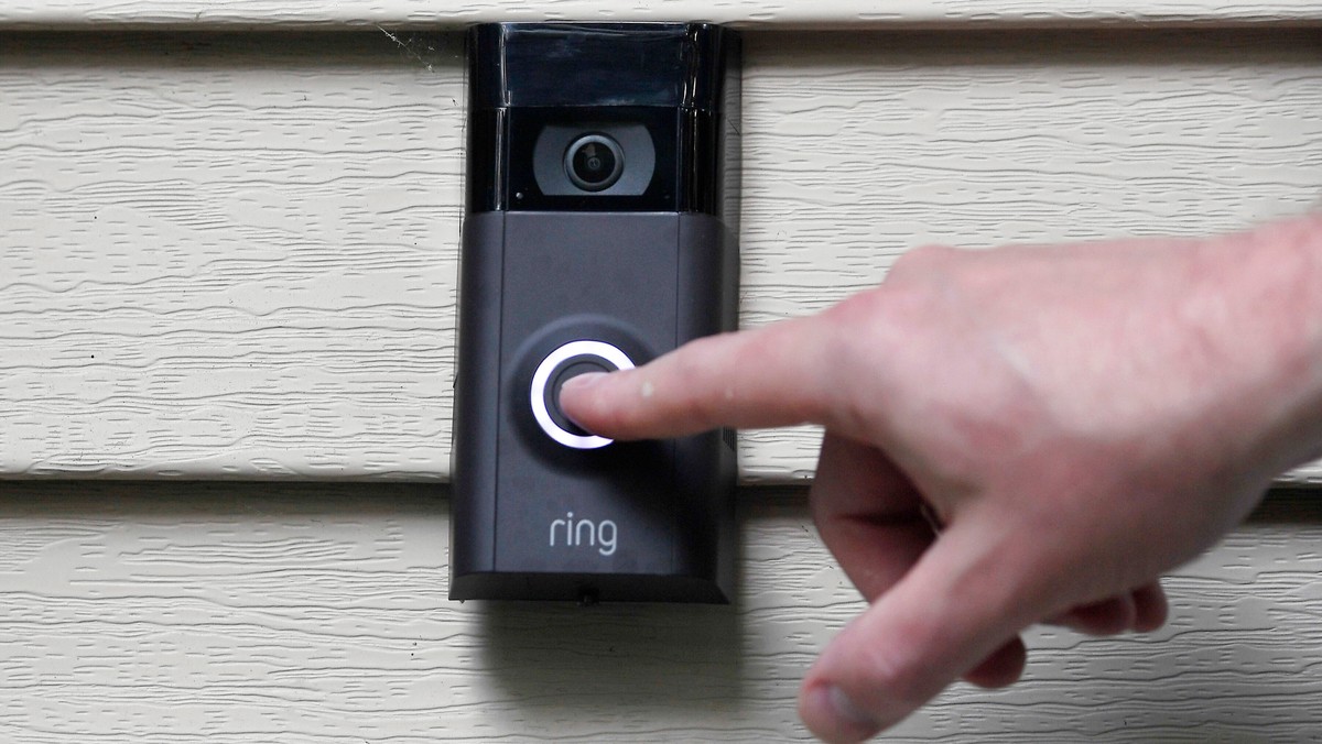 FILE - A person pushes the doorbell on their Ring doorbell camera, July 16, 2019, in Wolcott, Conn. (AP Photo/Jessica Hill, File)
Amazon-Ring