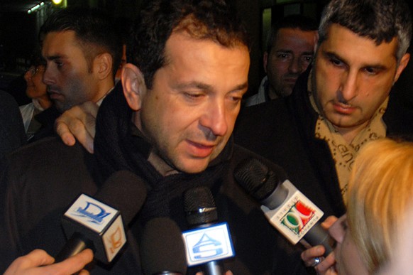 Catania soccer team president Antonino Pulvirenti is met by reporters as he exits Catania's Garibaldi Hospital, southern Italy, late Friday, Feb. 2, 2007. A police officer was killed Friday when fans rioted at a Serie A game between Sicilian sides Catania and Palermo, prompting the Italian soccer federation to postpone all league matches this weekend and cancel next week's friendly matches involving the national teams. (AP Photo/TanoPress, Pecoraro)