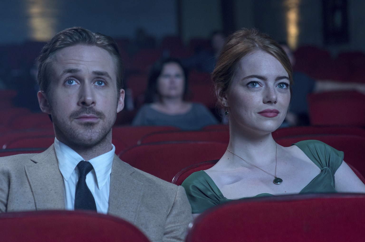 This image released by Lionsgate shows Ryan Gosling, left, and Emma Stone in a scene from, &quot;La La Land.&quot; (Dale Robinette/Lionsgate via AP)