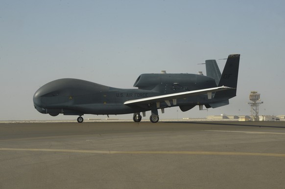 In this Feb. 13, 2018, photo released by the U.S. Air Force, an RQ-4 Global Hawk is seen on the tarmac of Al-Dhafra Air Base near Abu Dhabi, United Arab Emirates. Iran&#039;s Revolutionary Guard shot  ...