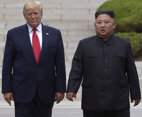FILE - President Donald Trump, left, meets with North Korean leader Kim Jong Un at the North Korean side of the border at the village of Panmunjom in Demilitarized Zone, June 30, 2019. (AP Photo/Susan ...