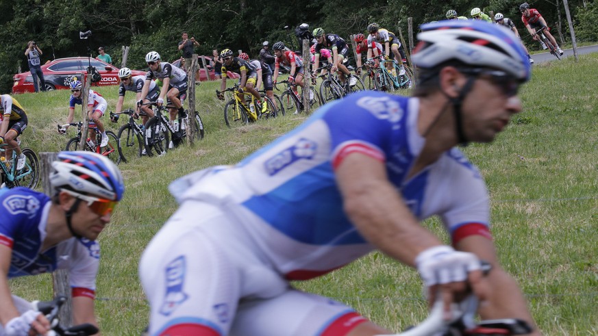 The breakaway group with Switzerland&#039;s Steve Morabito and Switzerland&#039;s Sebastien Reichenbach, front, speeds downhill during the nineteenth stage of the Tour de France cycling race over 146  ...