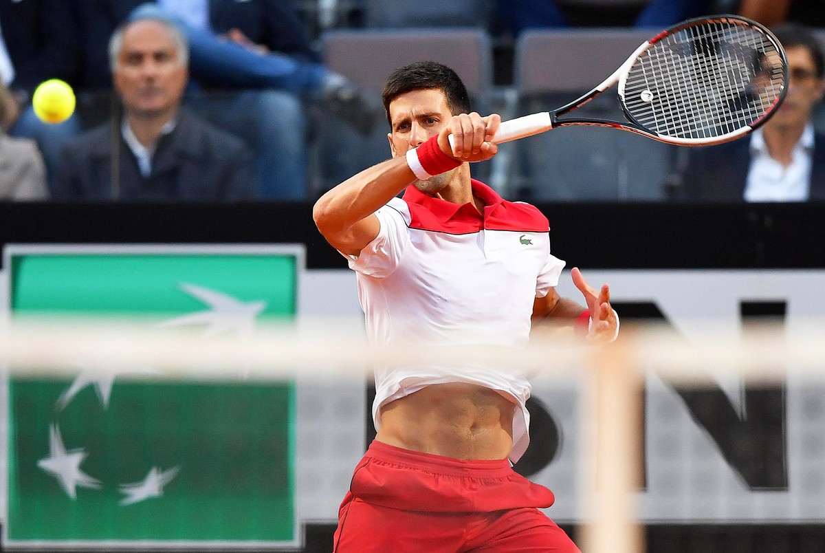 epa06745390 Novak Djokovic of Serbia in action against Albert Ramos-Vinolas of Spain during their men's singles third round match of the Italian Open tennis tournament in Rome, Italy, 17 May 2018 ...