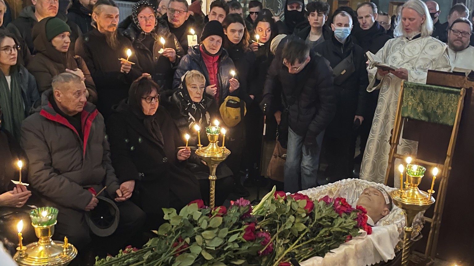 Relatives and friends pay their last respects at the coffin of Russian opposition leader Alexei Navalny in the Church of the Icon of the Mother of God Soothe My Sorrows, in Moscow, Russia, Friday, Mar ...