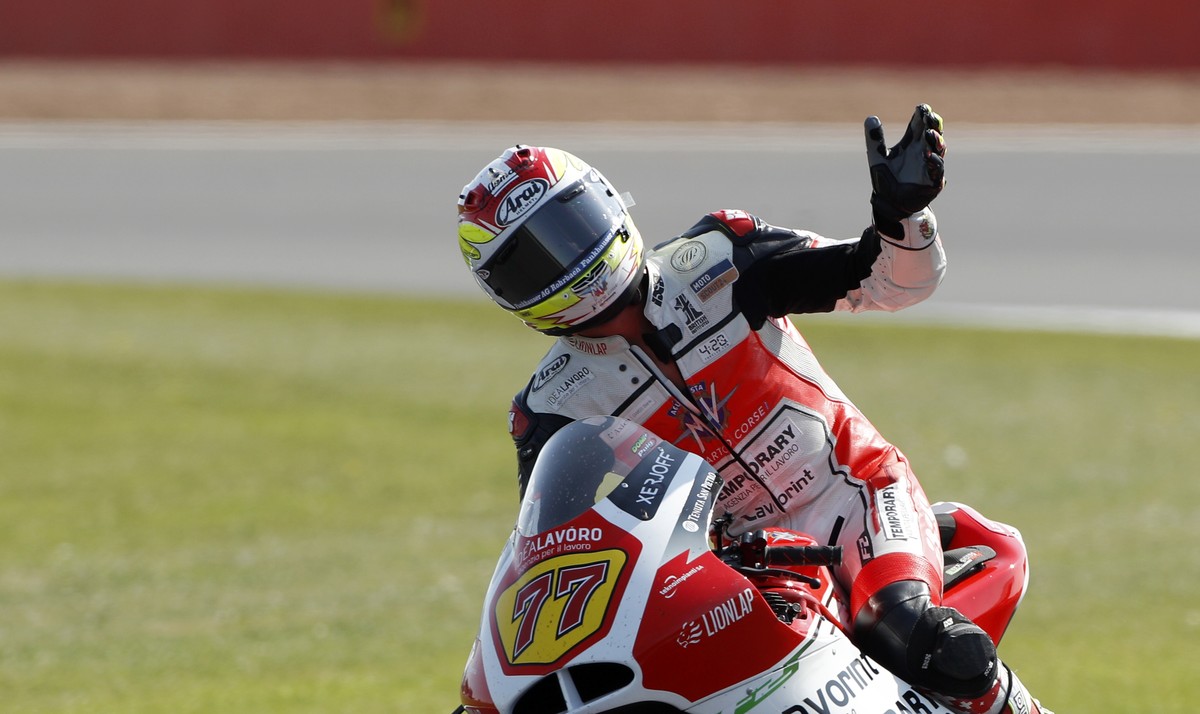 Switzerland's rider Dominique Aegerter of the MV Agusta Idealavoro Forward waves to supporters at the end of the Moto2 race at the British Motorcycle Grand Prix at the Silverstone racetrack, in S ...