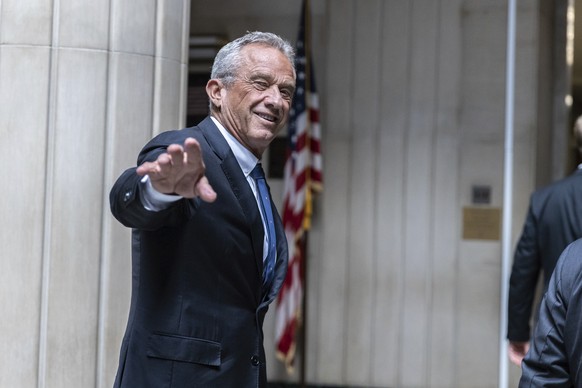 Independent presidential candidate Robert F. Kennedy Jr., waves to the media outside the Nassau County Supreme Court in Mineola, N.Y. on Wednesday, Aug., 21, 2024. (AP Photo/Stefan Jeremiah)