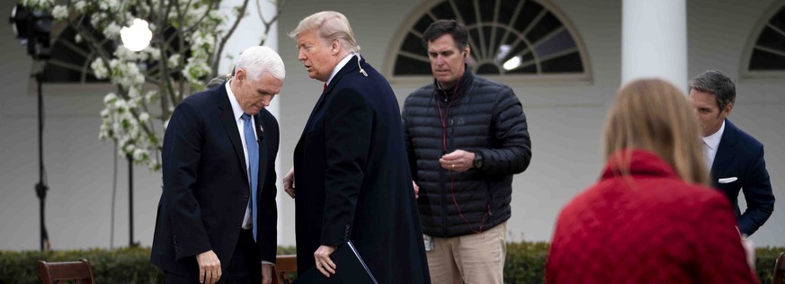 epa08319388 US President Donald J. Trump and Vice President Mike Pence as they participate in a Fox News Virtual Town Hall with Anchor Bill Hemmer, in the Rose Garden of the White House, Washington, D ...