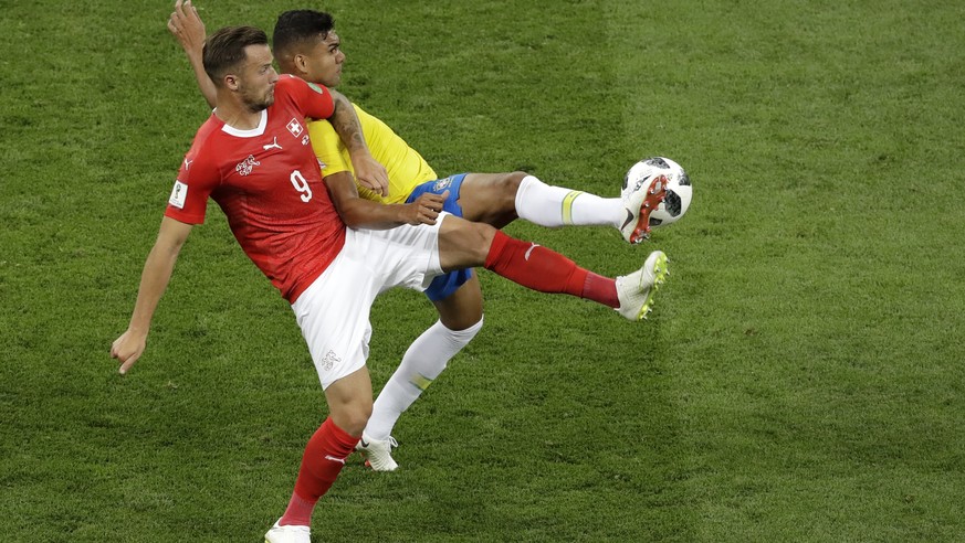 Switzerland&#039;s Haris Seferovic, left, and Brazil&#039;s Casemiro fight for the ball during the group E match between Brazil and Switzerland at the 2018 soccer World Cup in the Rostov Arena in Rost ...