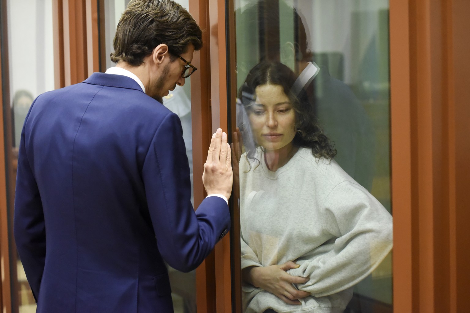 epa11549816 US and Russian citizen Ksenia Karelina stands in a glass cage during her treason trial in Sverdlovsk Regional court in Yekaterinburg, Russia, 15 August 2024. The Sverdlovsk Regional Court  ...