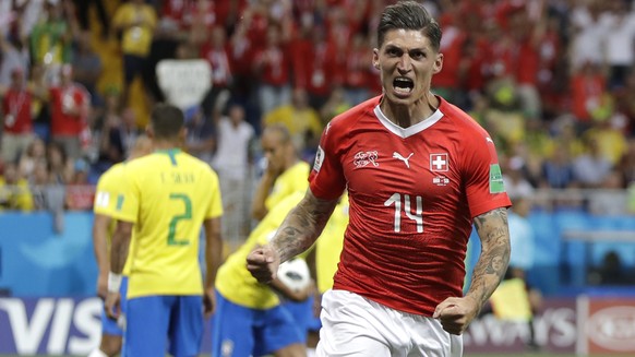 Switzerland&#039;s Steven Zuber celebrates after scoring his side&#039;s opening goal during the group E match between Brazil and Switzerland at the 2018 soccer World Cup in the Rostov Arena in Rostov ...