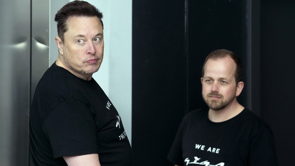 Tesla CEO Elon Musk, left, and Andr