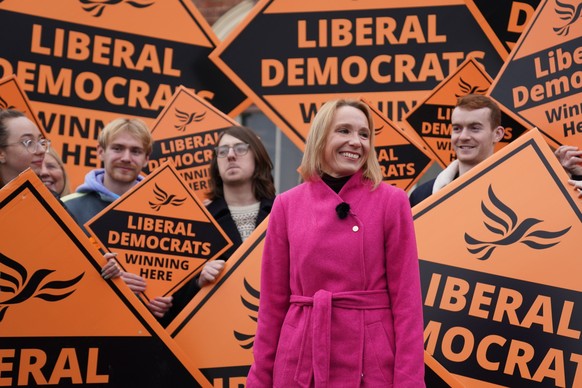 Newly elected Liberal Democrat lawmaker Helen Morgan, celebrates in Oswestry, Shropshire, England, Friday Dec. 17, 2021, following her victory in the North Shropshire by-election. U.K. Prime Minister  ...