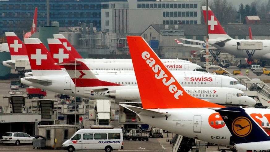 epa06086448 (FILE) - A file picture dated 06 March 2003 shows airplanes of Swiss International Air Lines, EasyJet and Austrian Airlines, park at the airport in Zurich, Switzerland. Easyjet announced 1 ...