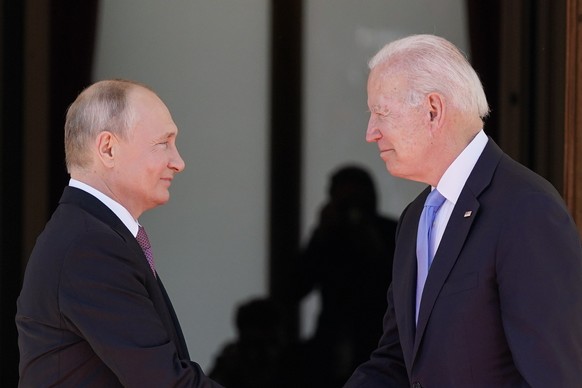 FILE - In this June 16, 2021 file photo, President Joe Biden and Russian President Vladimir Putin, arrive to meet at the &#039;Villa la Grange&#039;, in Geneva, Switzerland. In their search for a new  ...