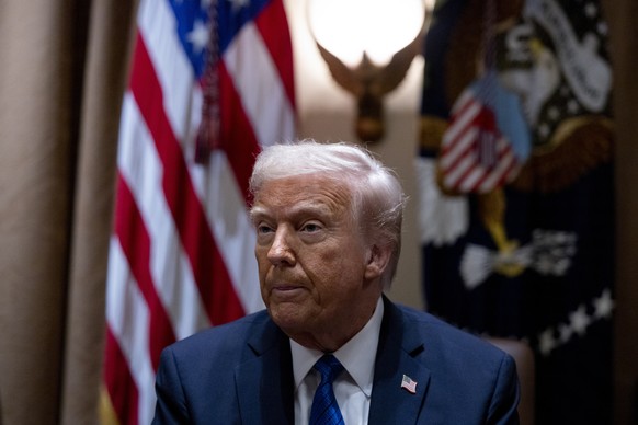 epaselect epa11988164 US President Donald Trump responds to questions from the news media during a meeting with ambassador nominees in the Cabinet Room of the White House in Washington, DC, USA, 25 Ma ...