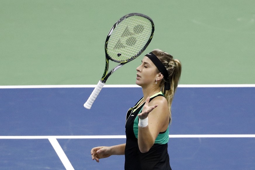 Belinda Bencic of Switzerland throws her racket during her first round match against Carina Witthoeft of Germany, at the WTA Ladies Open tennis tournament in Biel, Switzerland, Tuesday, April 11, 2017 ...