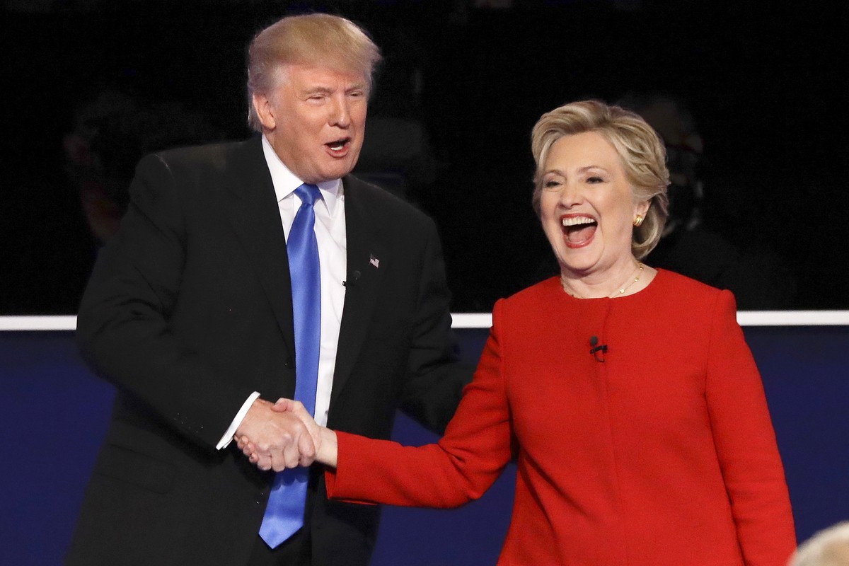 FILE - Republican presidential nominee Donald Trump, left, and Democratic presidential nominee Hillary Clinton shake hands after the presidential debate in Hempstead, N.Y., Sept. 26, 2016. (AP Photo/D ...