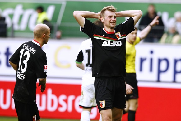 WOLFSBURG, GERMANY - MARCH 22: Jan Ingwer Callsen Bracker of Augsburg appears frustrated during the Bundesliga match between and VfL Wolfsburg and FC Augsburg at Volkswagen Arena on March 22, 2014 in  ...