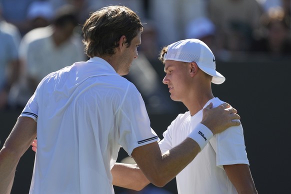 Nicolas Jarry of Chile, left, greets Holger?Rune?of Denmark at the net after winning their first round men&#039;s singles match at the Wimbledon Tennis Championships in London, Monday, June 30, 2025.  ...