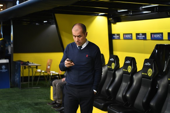 Monaco manager Leonardo Jardim looks at his smartphone in the Signal Iduna Park in Dortmund, Germany, Tuesday, April 11, 2017. The first leg of the Champions League quarter final soccer match between  ...